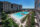 Resort style pool surrounded by lounge chairs