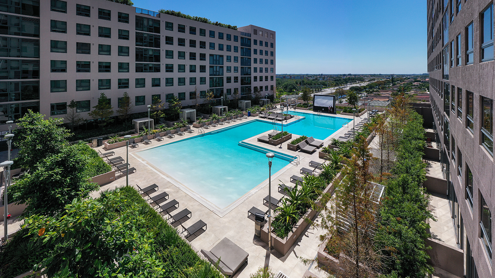 Resort style pool surrounded by lounge chairs