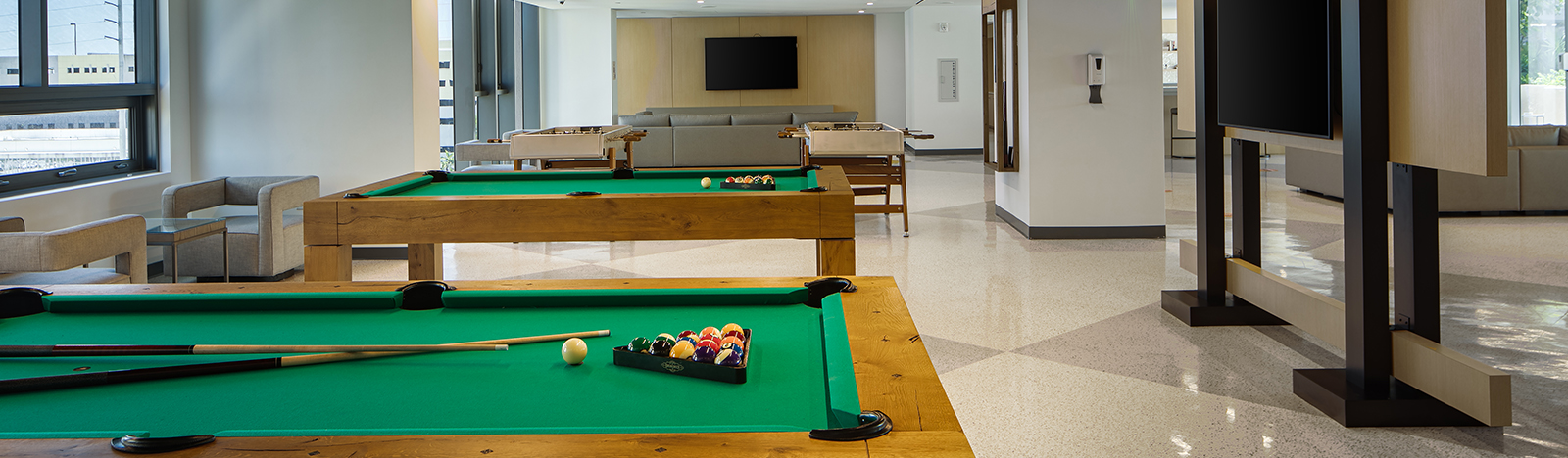 Resident lounge featuring two pool tables